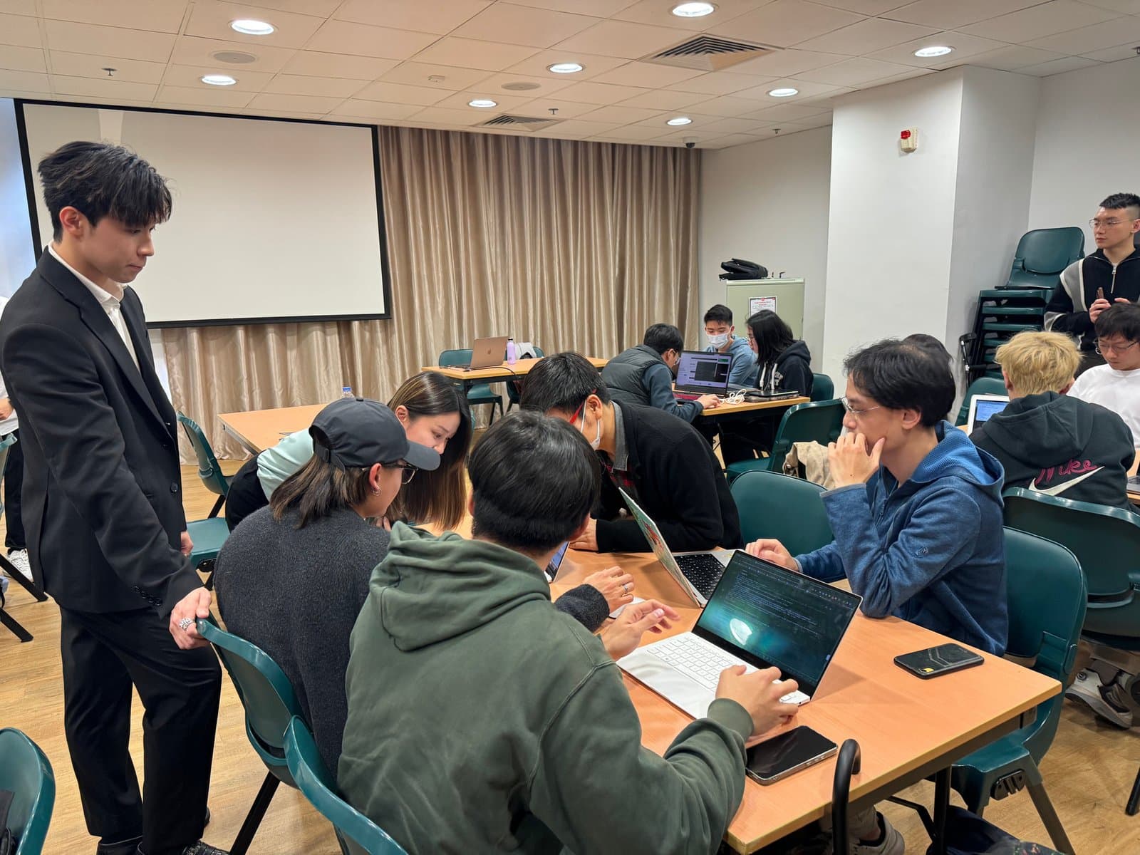 Hands-on guidance at laptops during the advanced workshop
