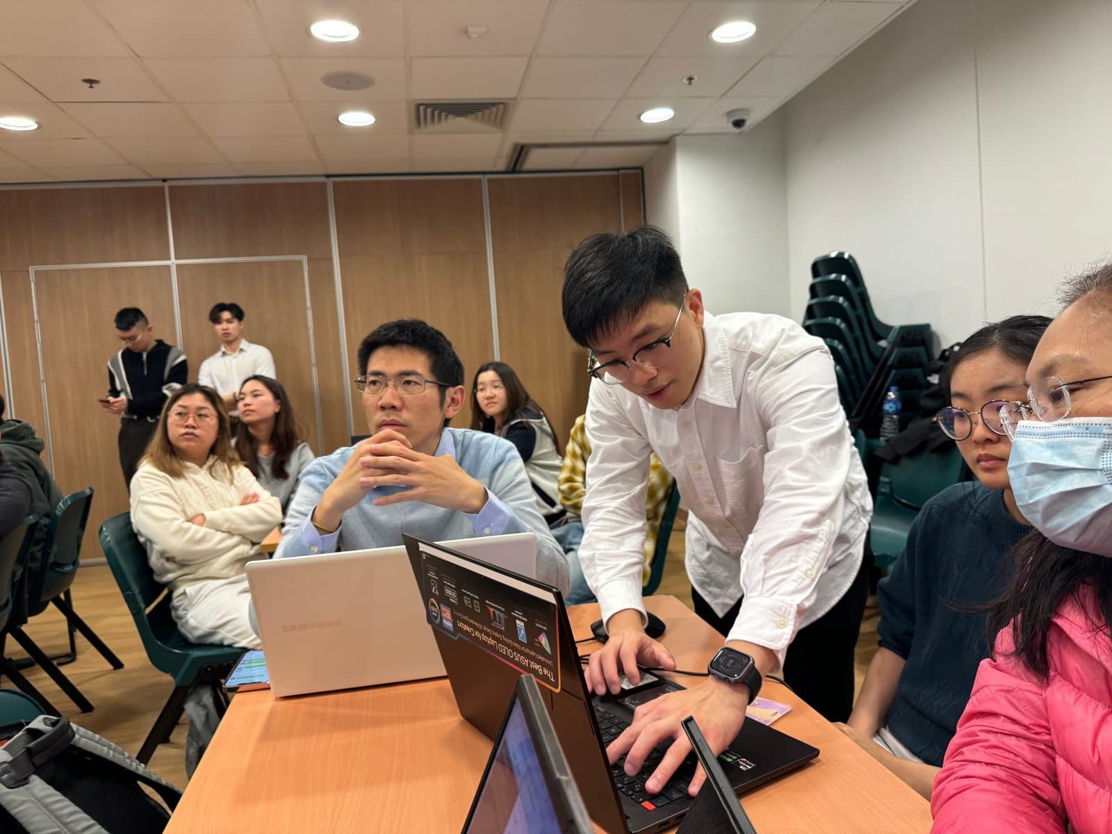 A facilitator helping participants configure their AI setup